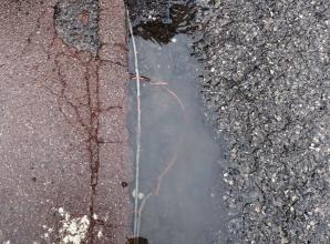 Car park pothole which exposed mains wires deemed safe by council