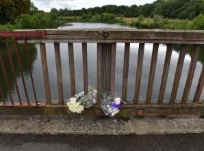 TAPLOW 134647-1. Flowers left at the Jubilee River in memory of Ruben Iwe , who died aged 16 in the river in June 2022.