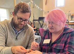 MP (and family) in knitting workshop at cafe