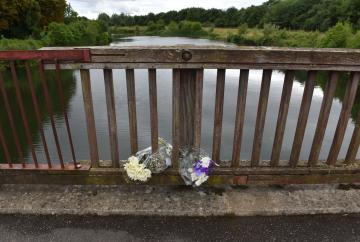 TAPLOW 134647-1. Flowers left at the Jubilee River in memory of Ruben Iwe , who died aged 16 in the river in June 2022.